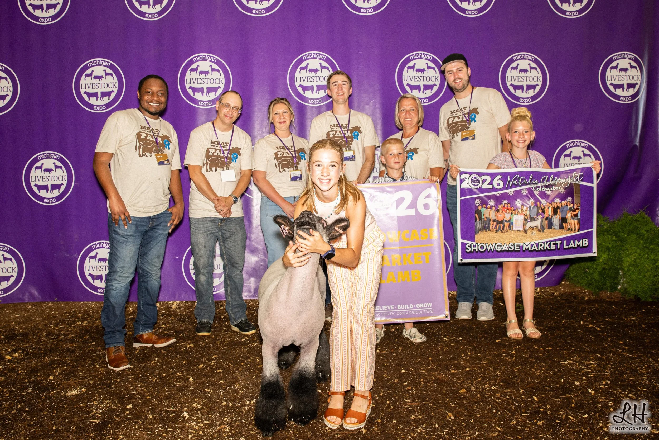 Saleabration backdrop with Natalie Albright, buyers and Showcase Market Lamb 2026