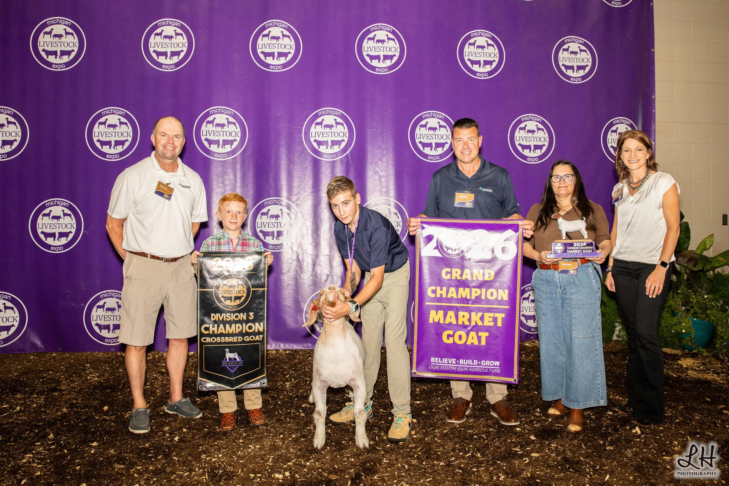 Saleabration 2026 backdrop Grand Champion Market Goat shown by Jackson Aldrich 2026