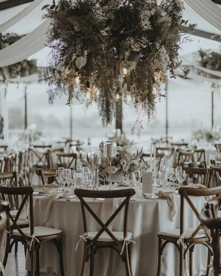 Reminiscing over last year's dreamy reception setup with the loveliest soft tones.

@mquisite's soft draping, @bloem_floral_studio's stunning florals, and our custom naked bulb light installation.

Venue: @kayandmonty 
Planning &amp; Coordination: @w