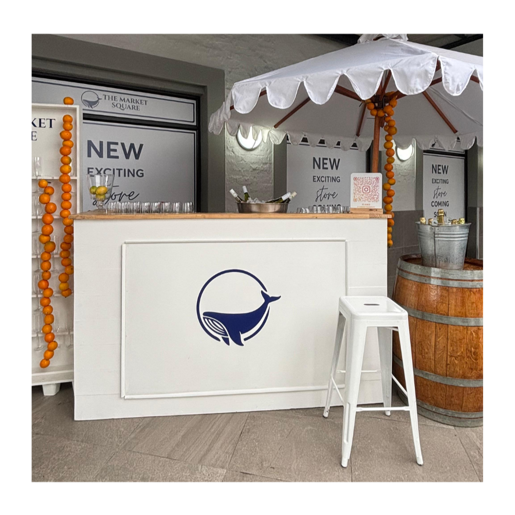 white Custom modular bar counters with scallop umbrella in multiple sizes for wedding and corporate event hire by Du Toit Events in Plettenberg Bay and the Garden Route