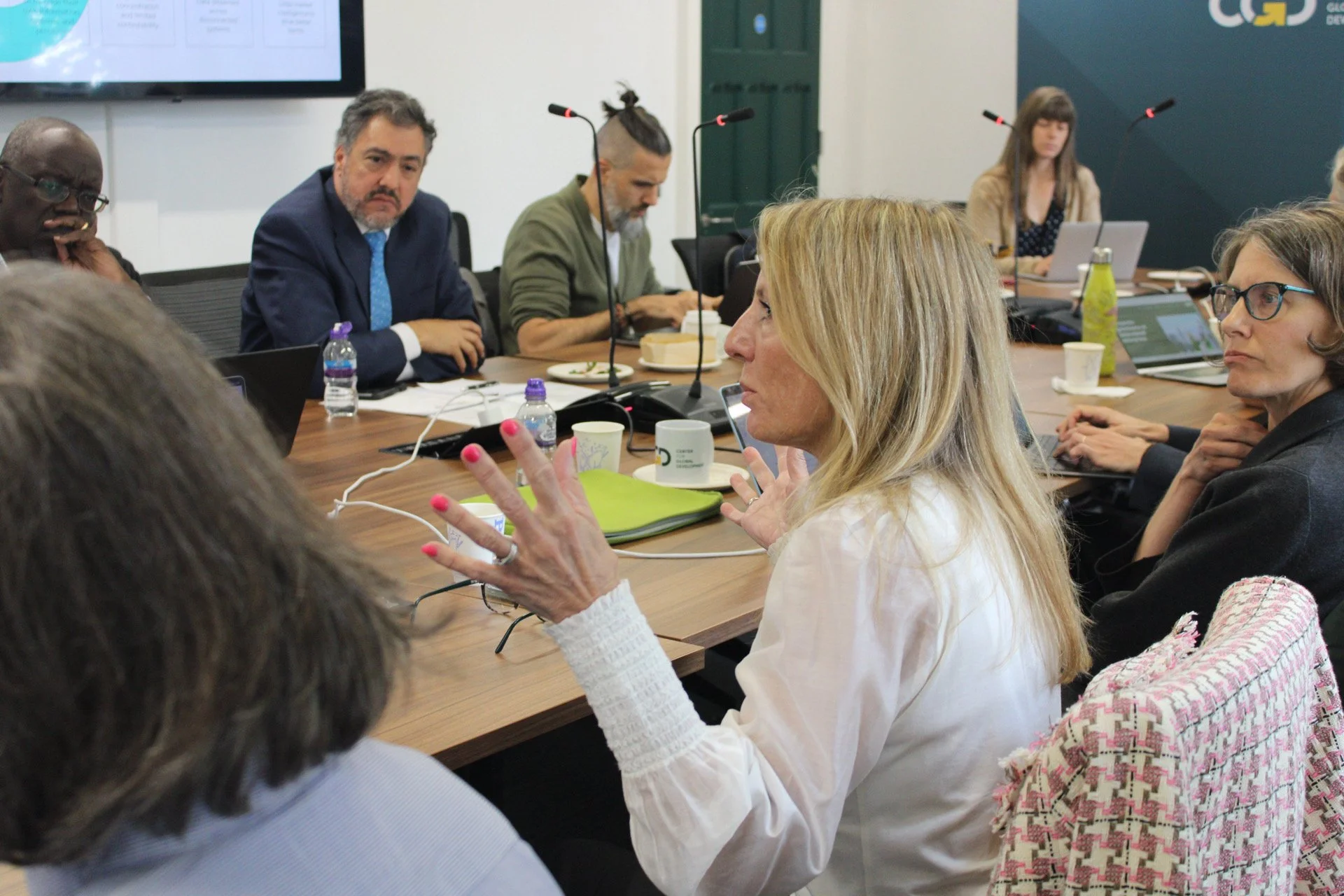 Board members in a meeting with the team.