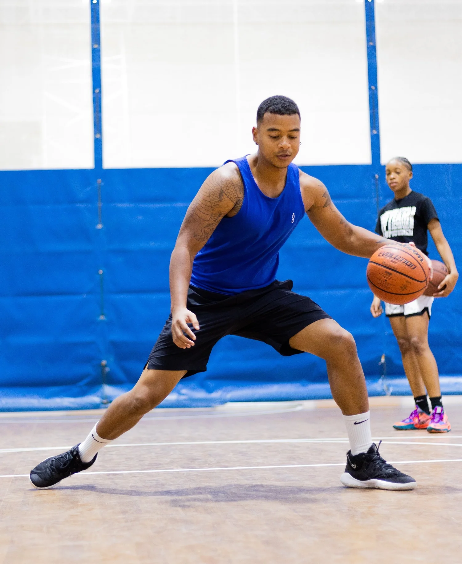 Hoop Remedy coach demonstrating technique with older athlete