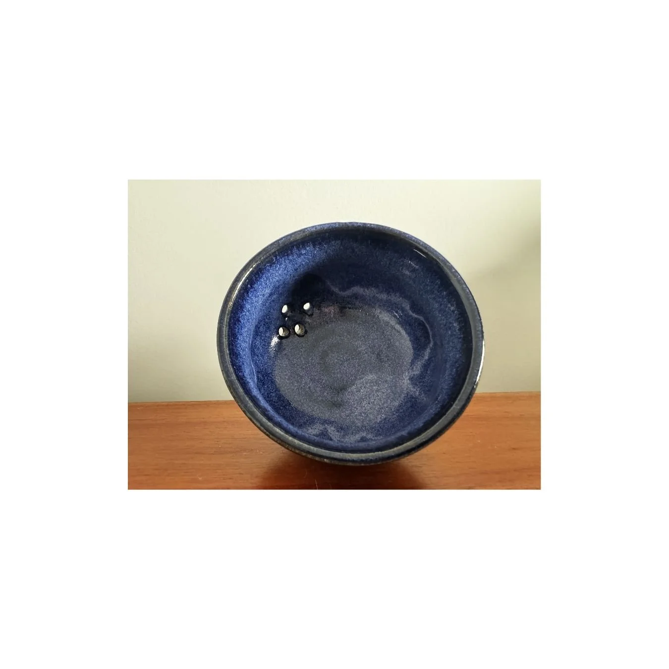 blue berry bowl with holes.jpg