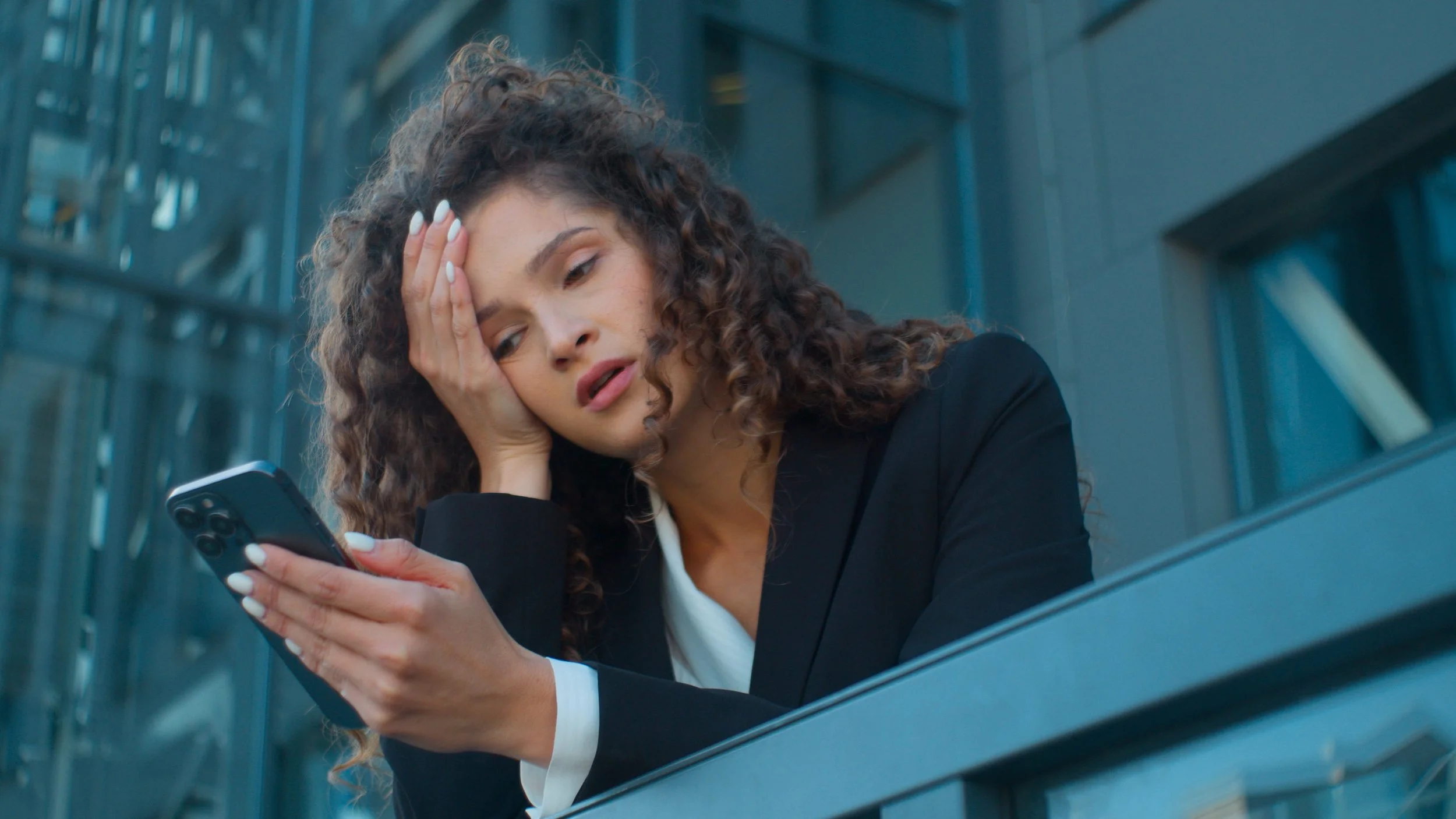 Woman reading her phone and anxiety hits