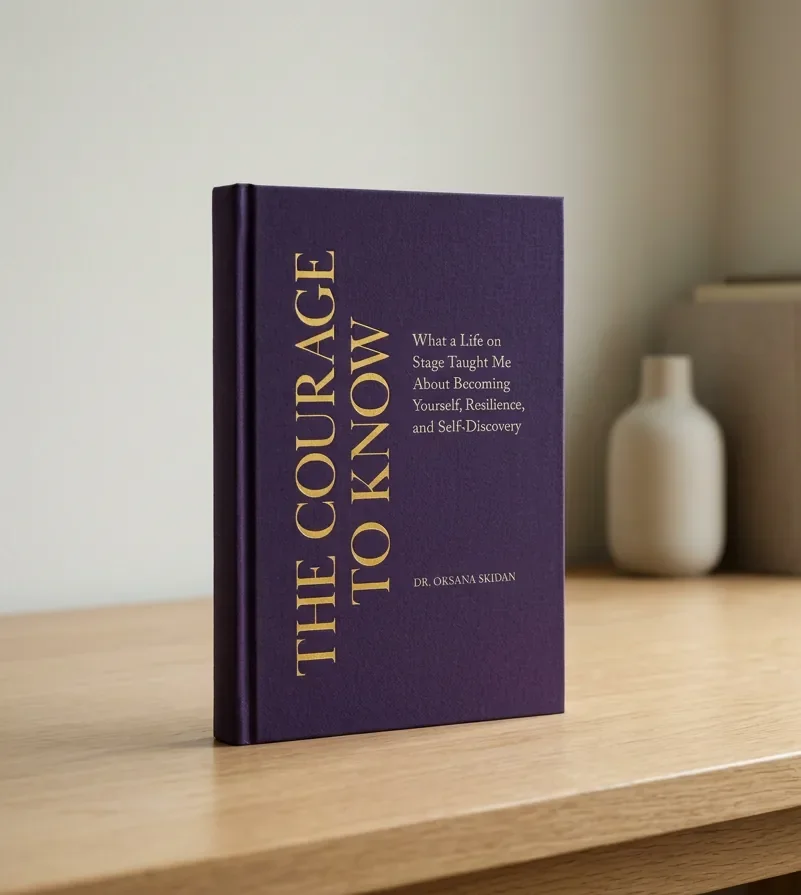 The Courage to Know by Dr. Oksana Skidan, displayed on a wooden table.