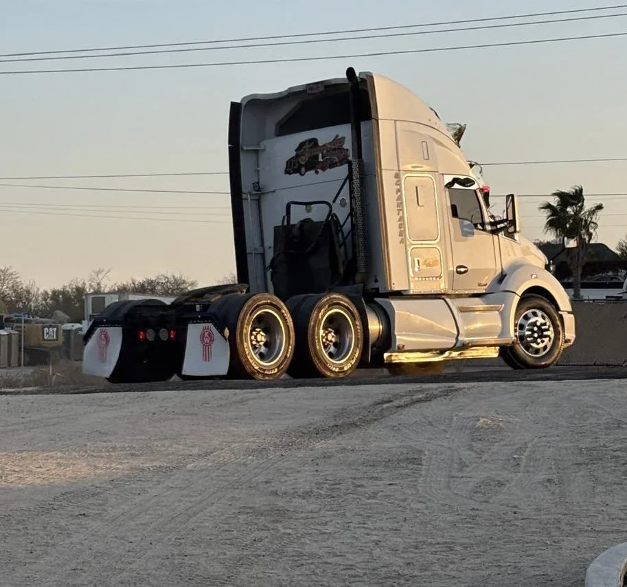 white rig pulling out.jpg