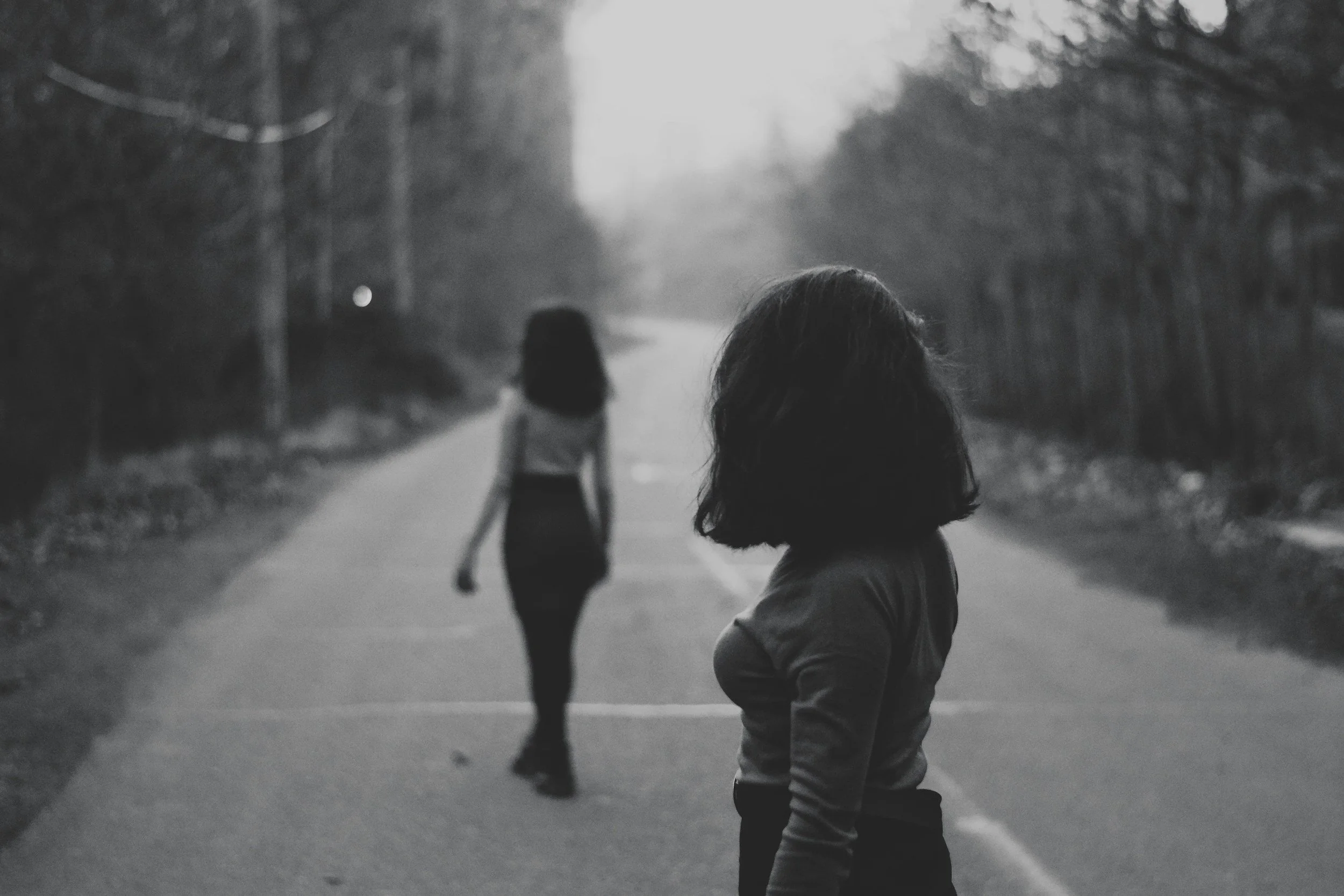 woman looking at another woman with a jealous look