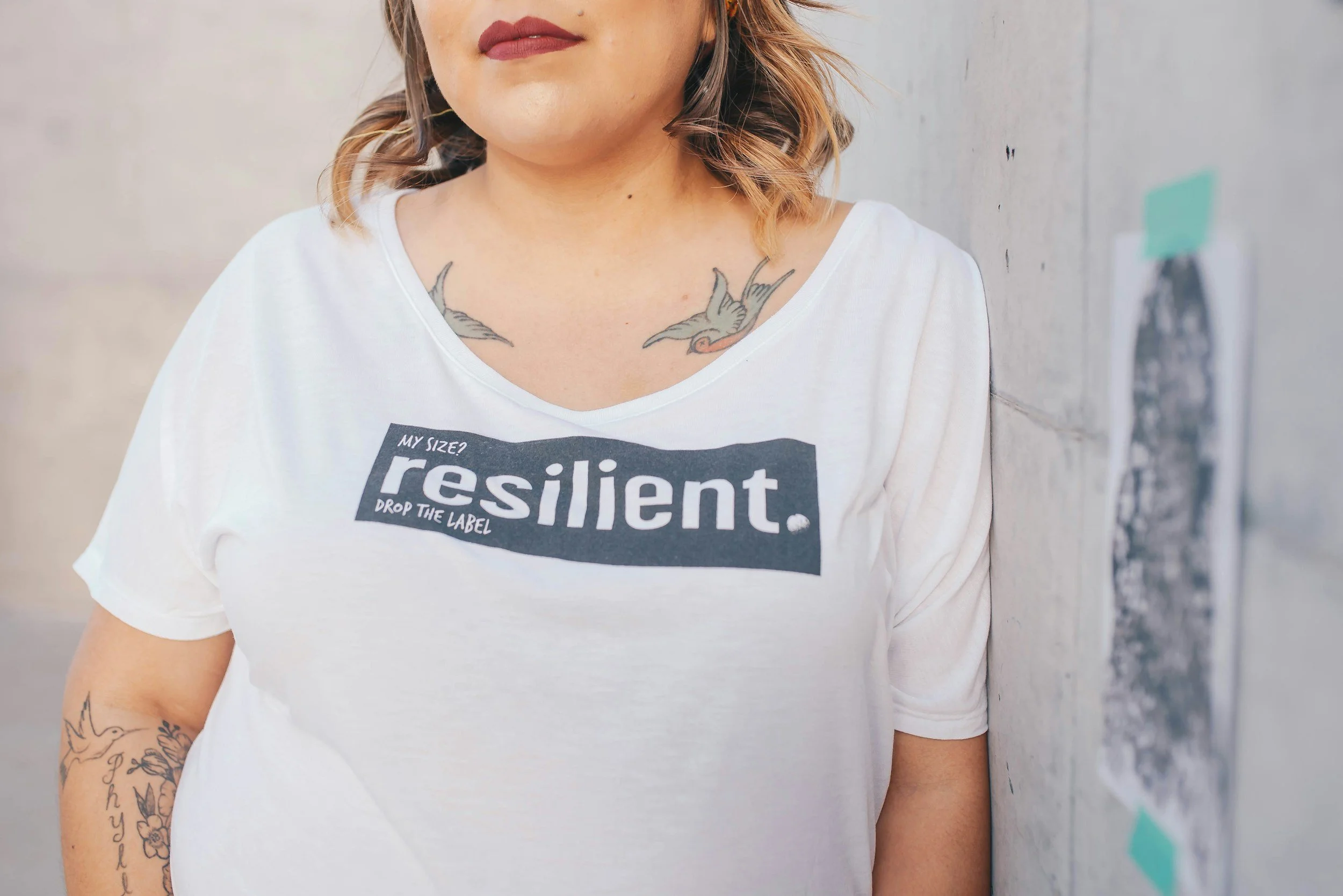 women with a tshirt that says 'resilient'