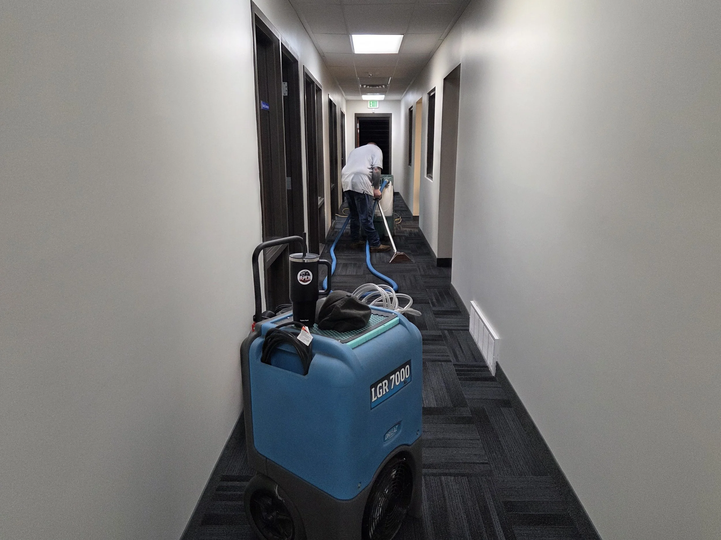Apex Restoration technician assessing commercial property damage in Utah
