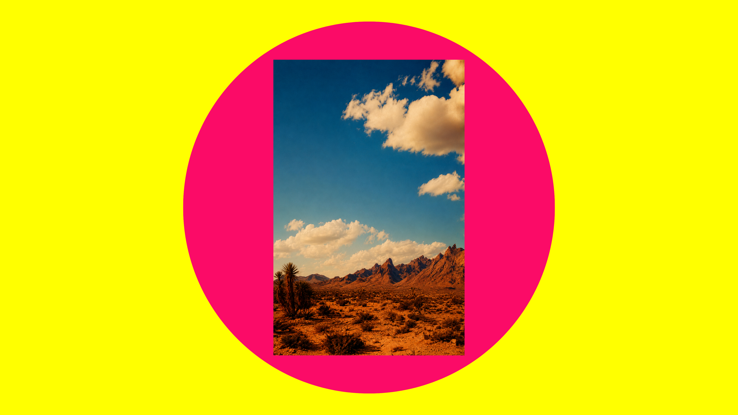 A desert landscape with rocky mountains, sparse desert vegetation, and a few palm trees under a partly cloudy sky.