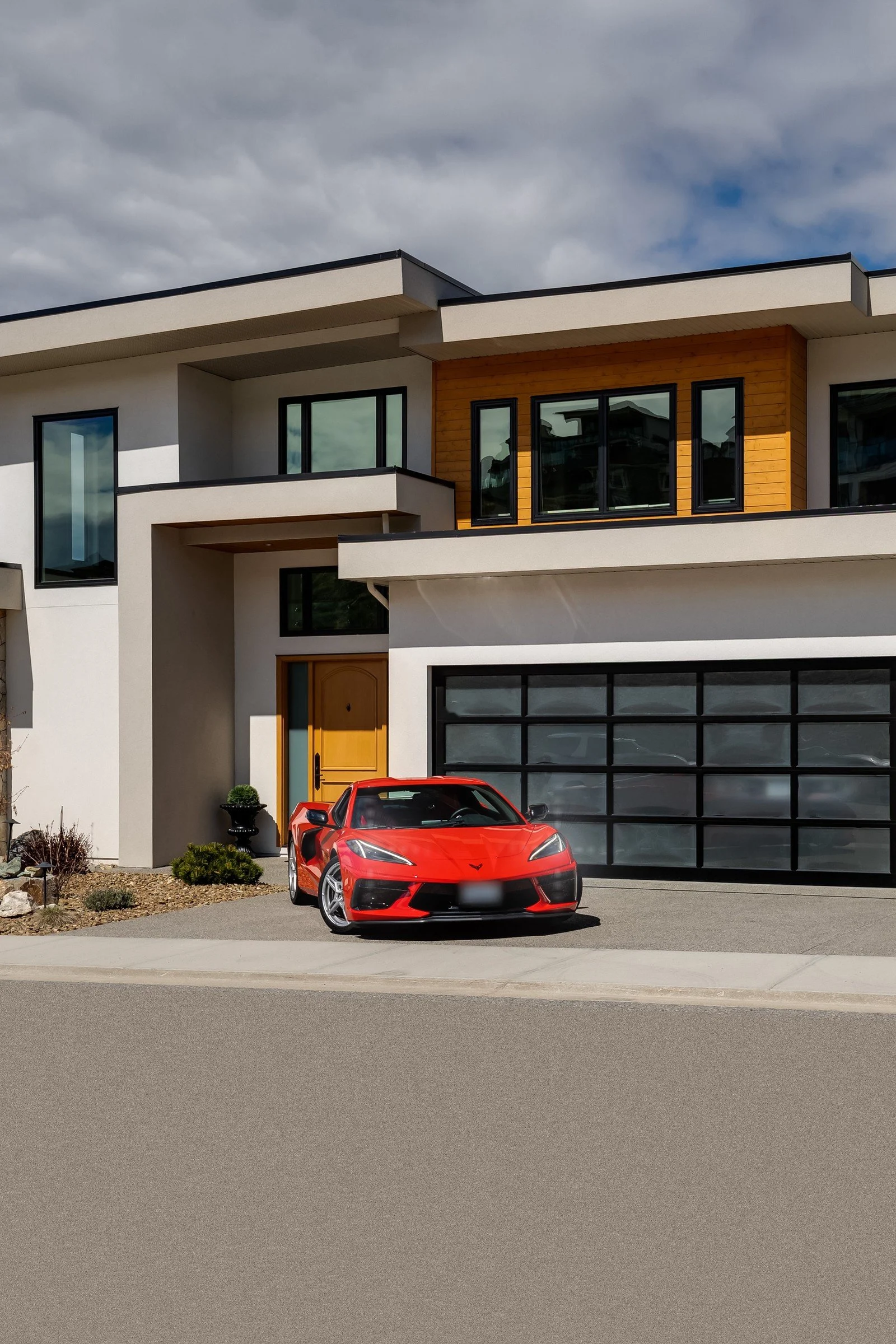 Modern home with red car