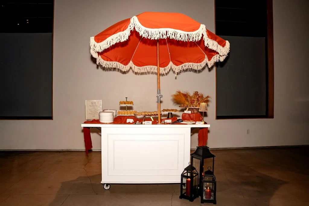 Cookie Cart with elaborate dessert display in a warehouse venu