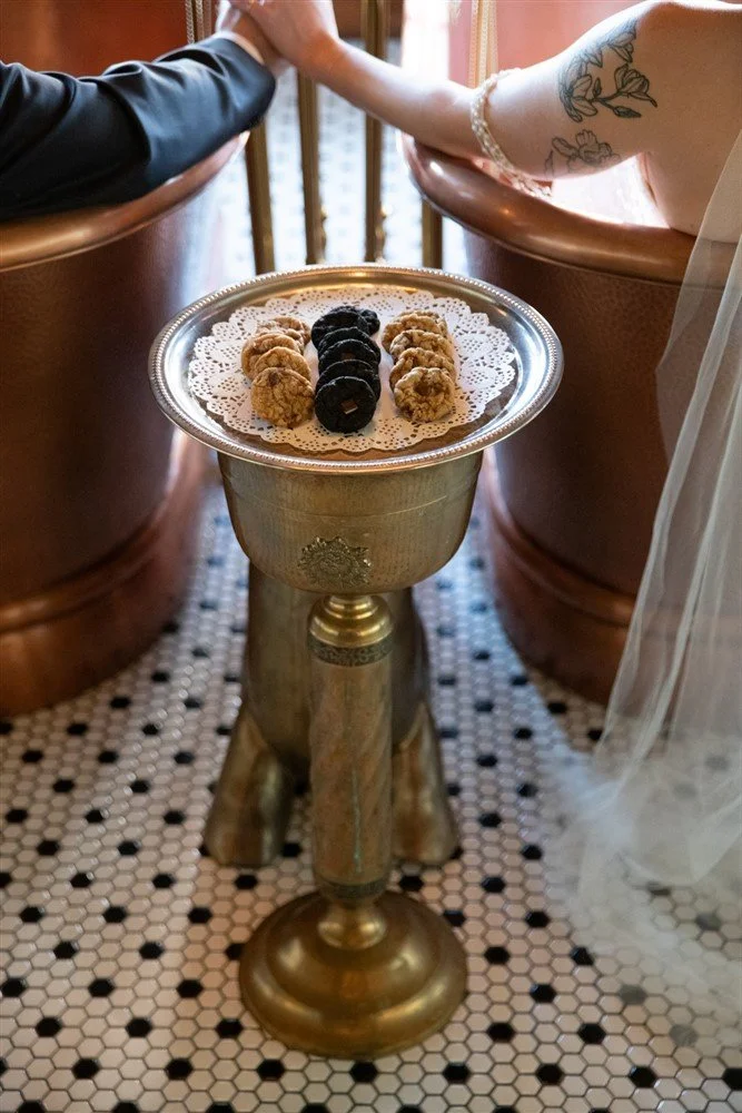Close up of cookies on a silver platter in a hotel guest bathroom