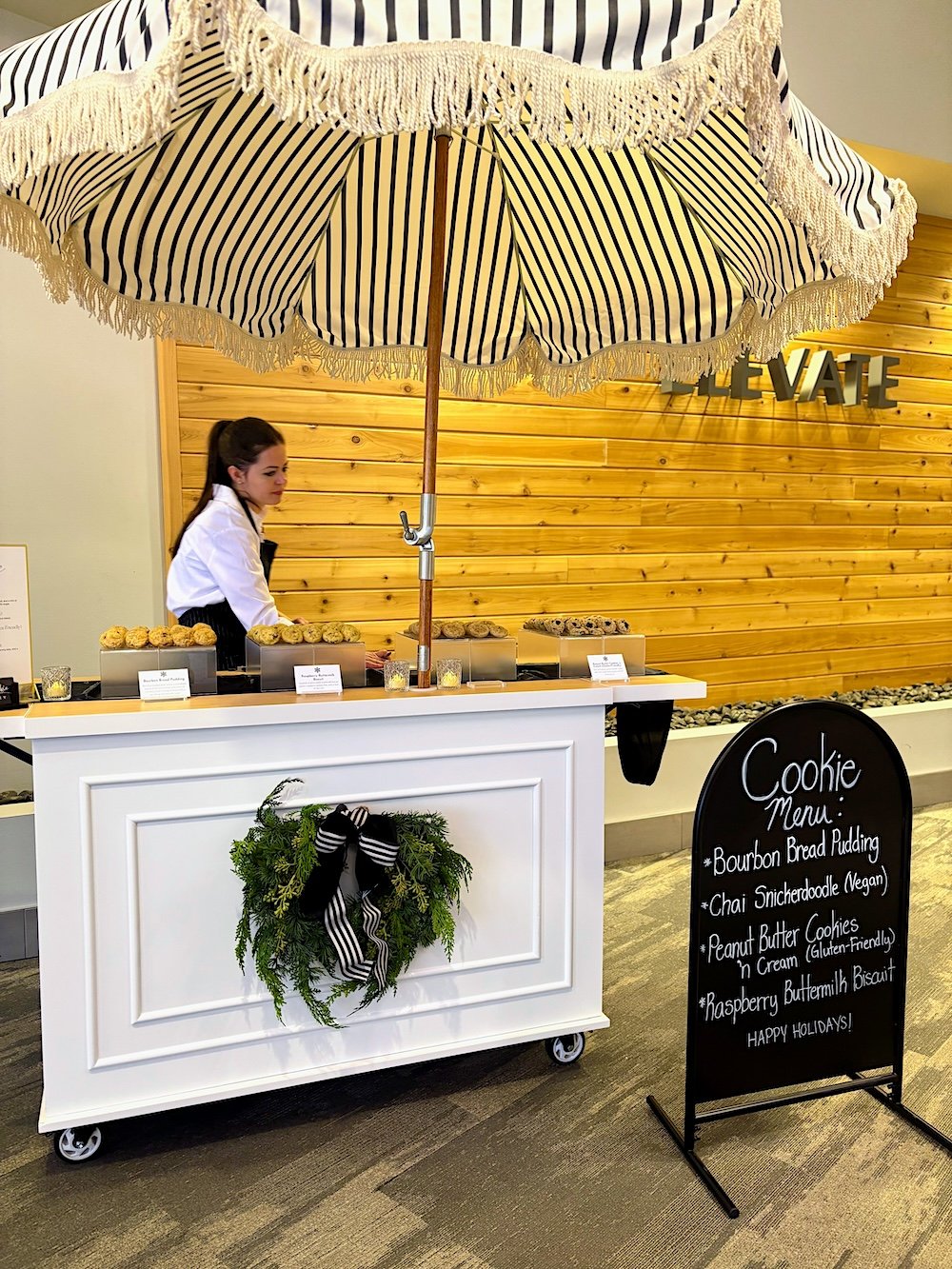 Tiny Cookie Trolley dessert attendant getting ready to serve office workers