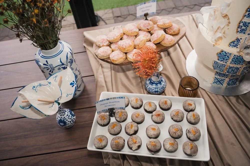 Overhead shot of plated desserts with floral accents