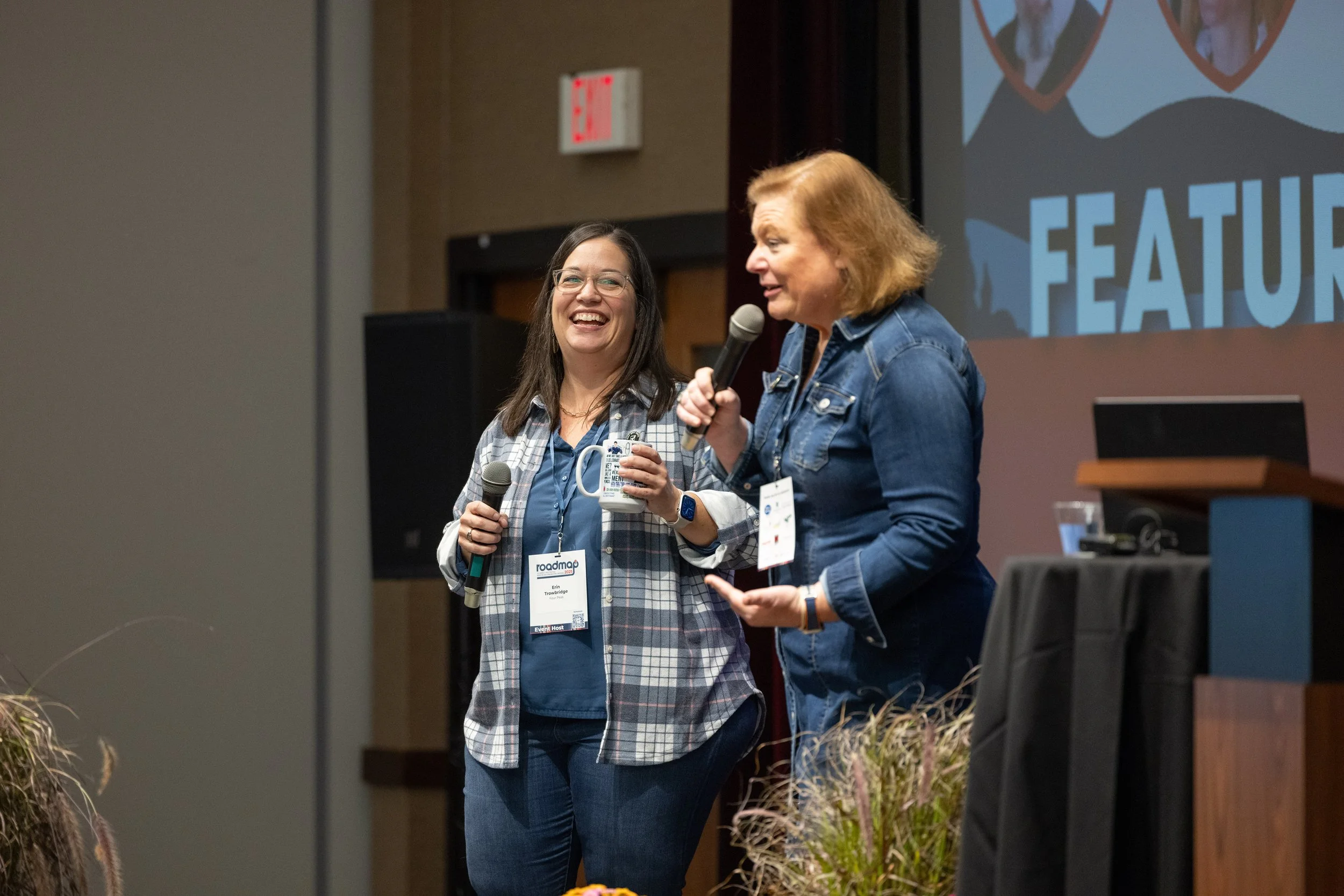 Erin and Lee speaking on stage