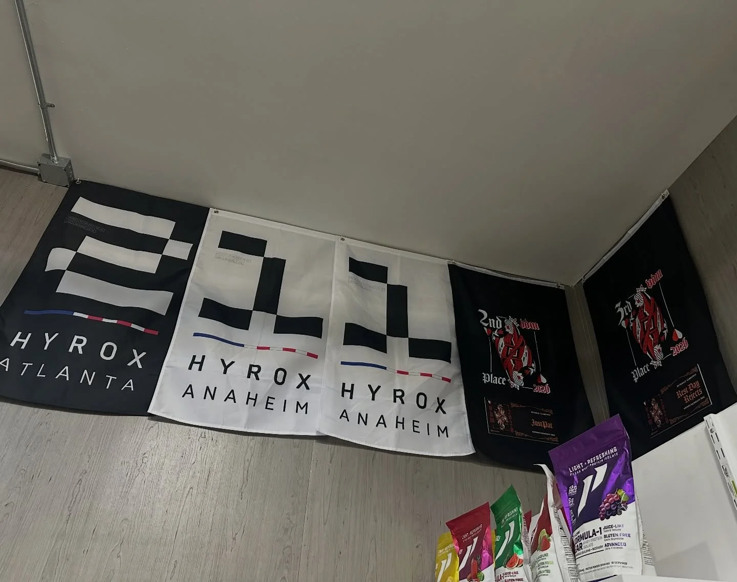 Getting our flag wall started with some @hyroxamerica flags and our most recent @vdmthecomp flags, all won by our awesome members. Hoping to build this up more throughout the year!!! 🏆