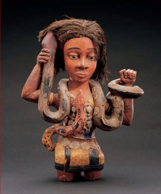 Akpan Chukwu or John Onyok, Annang Ibibio peoples, southeastern Nigeria Mami Wata figure, 1950s Wood, paint, raffia; 40.6cm (16")

Collection of Herbert M. and Shelley Cole; L2007.22.1

Based on a nineteenth-century chromolithograph of a snake charme