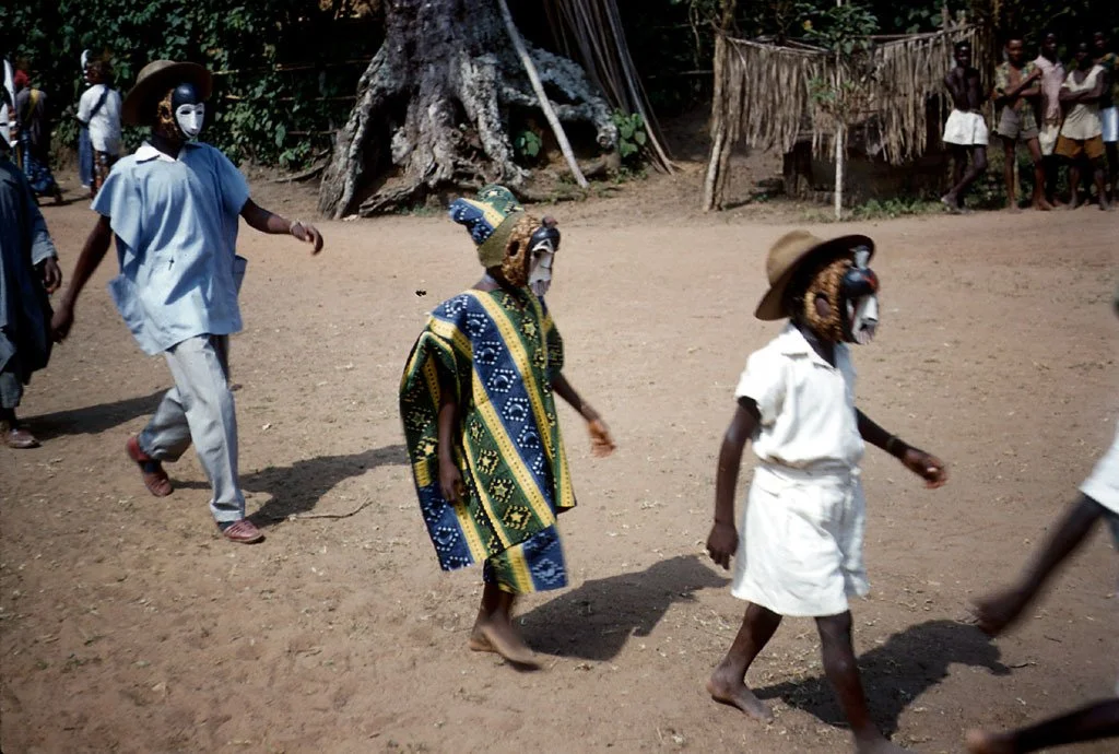 Two small boys toward the end of an njenje.