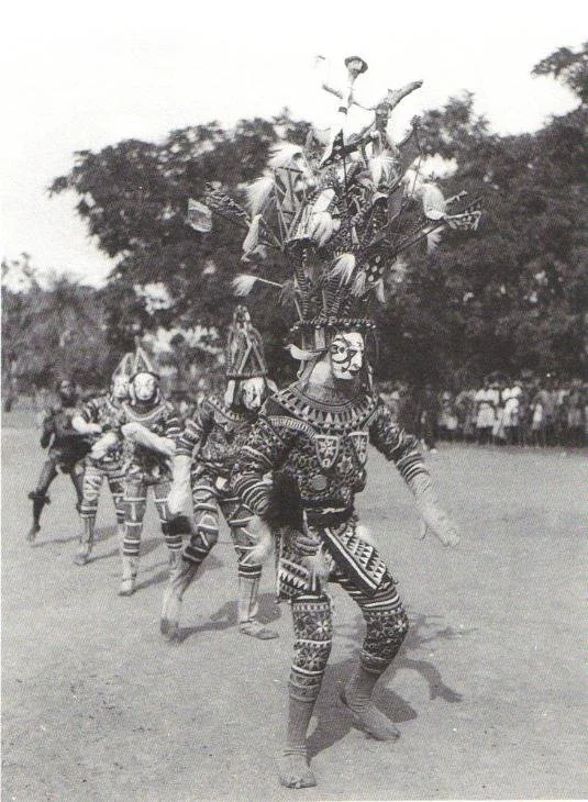Igbo maiden spirit maskers near Akwa, Nigeria 1935.