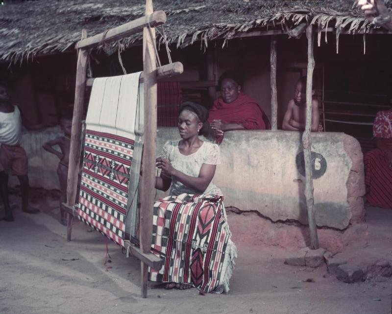 An Igbo woman works at her loom.