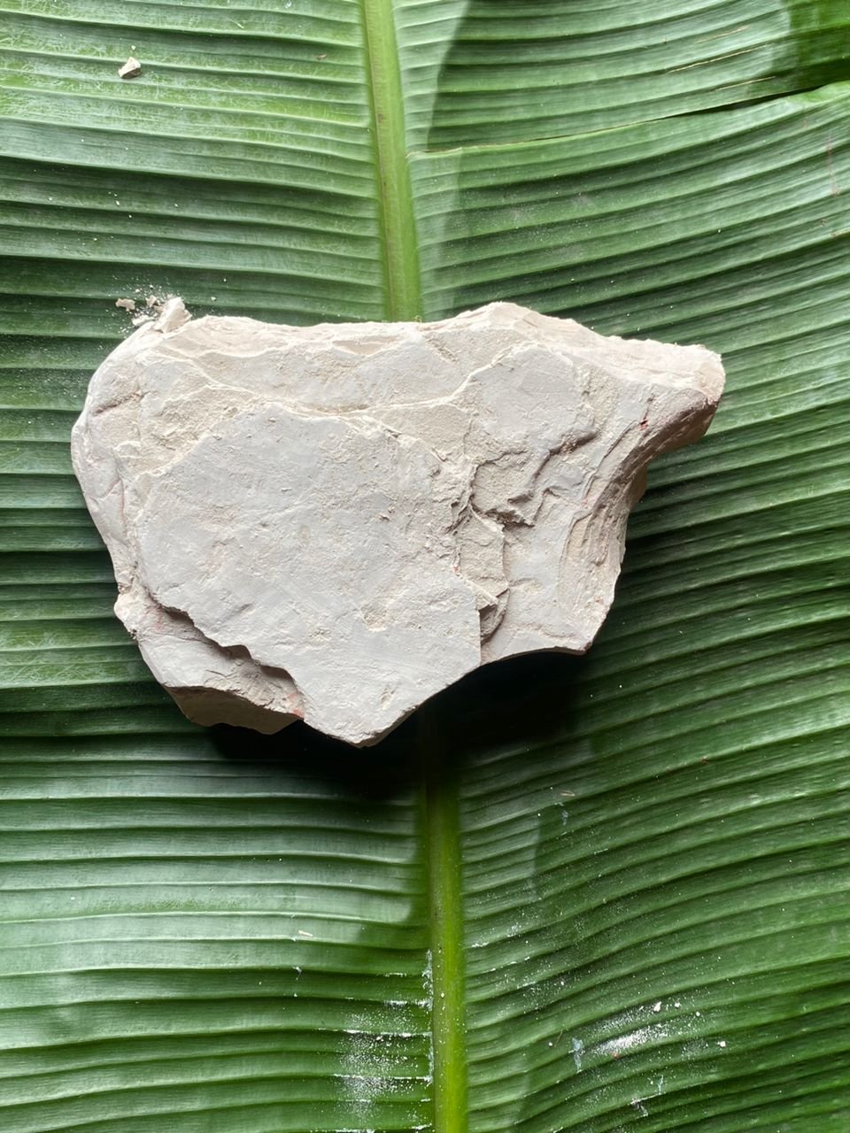 White colored Nzu Ndiichie, harvested directly from the earth in its natural state and highly sought after for use in rituals.