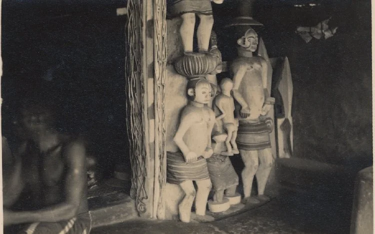 Interior of a traditional Igbo house, ancestral statues, 1930s. 📸: Edward Chadwick.