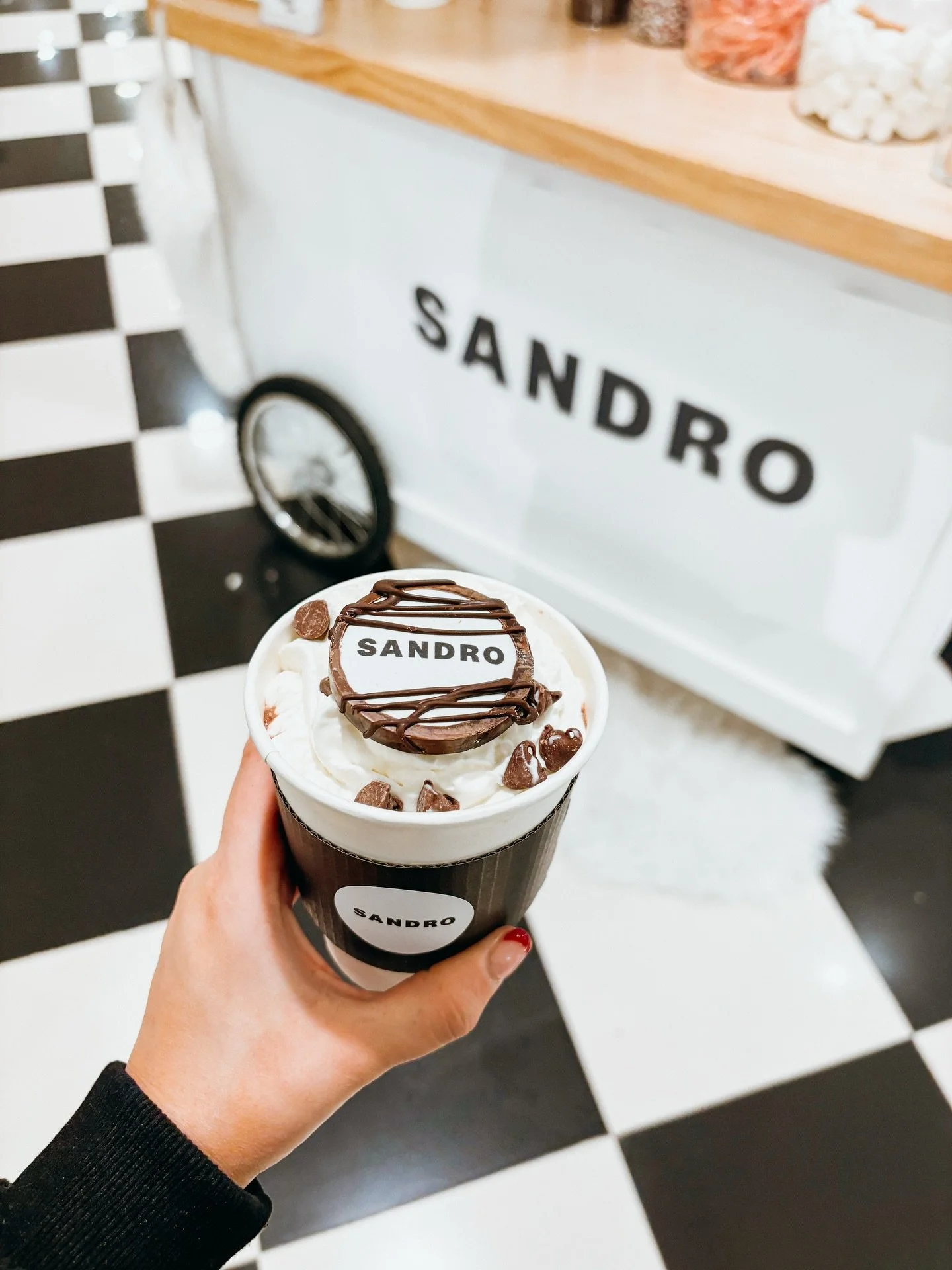 swipe to the end to see who crashed our hot cocoa cart . . . 🎅🏻🤍

This @sandroparis hot cocoa cart at @bloomingdales is *exactly* why brand activations are the heartbeat of Sugar On The Rim. 

Pulling Sandro&rsquo;s brand identity into every eleme