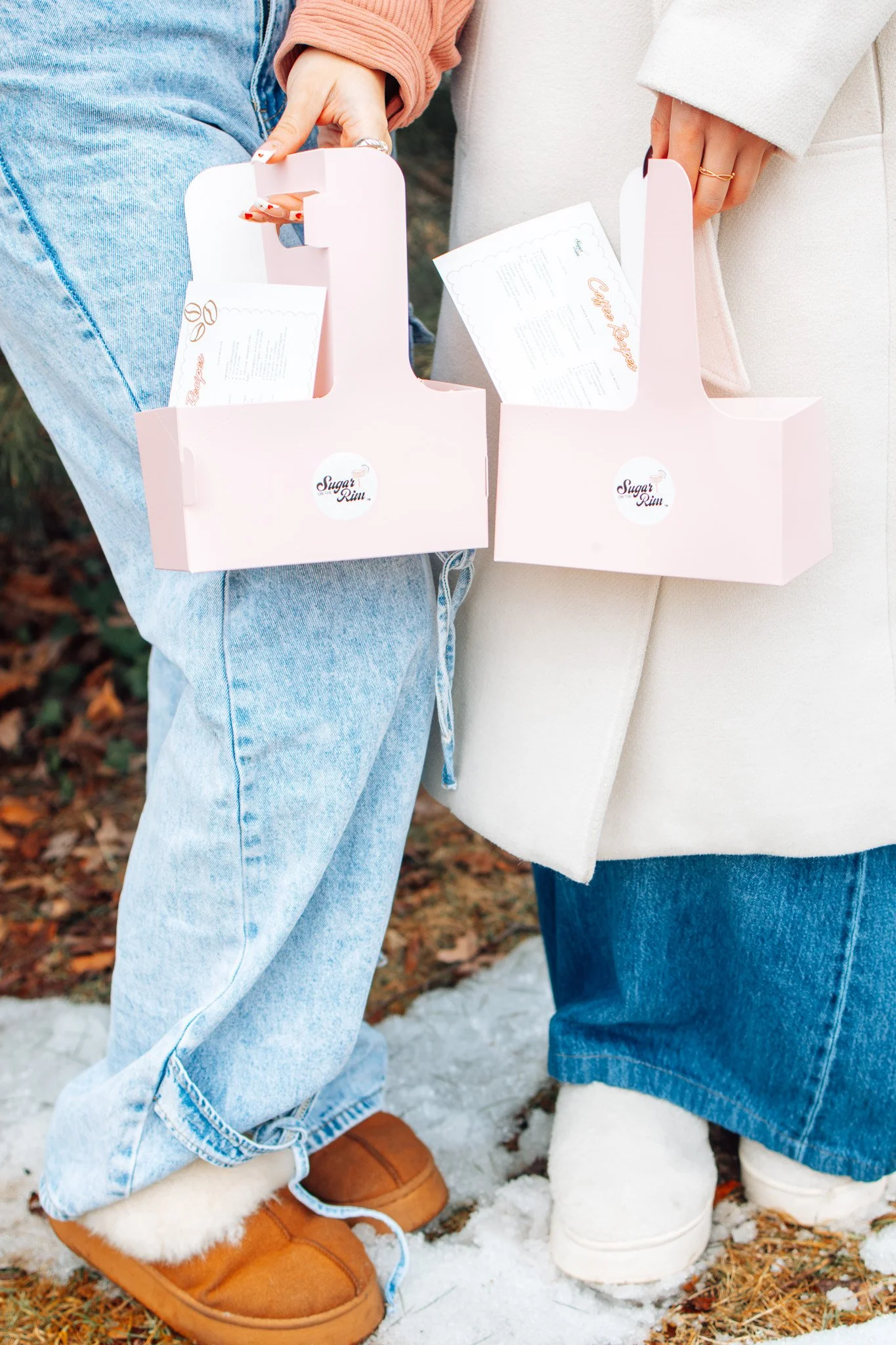 Person pouring liquid into a jigger for cocktail preparation.