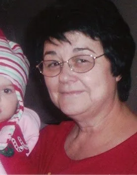 Shirley Mulrooney smiling with a grandchild