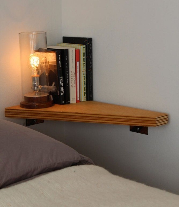 No space for a nightstand? Mount a shelf in the corner instead!