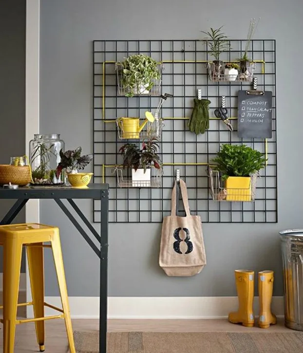 This person created a hanging garden wall, by hanging tools and plants to a wire grid.