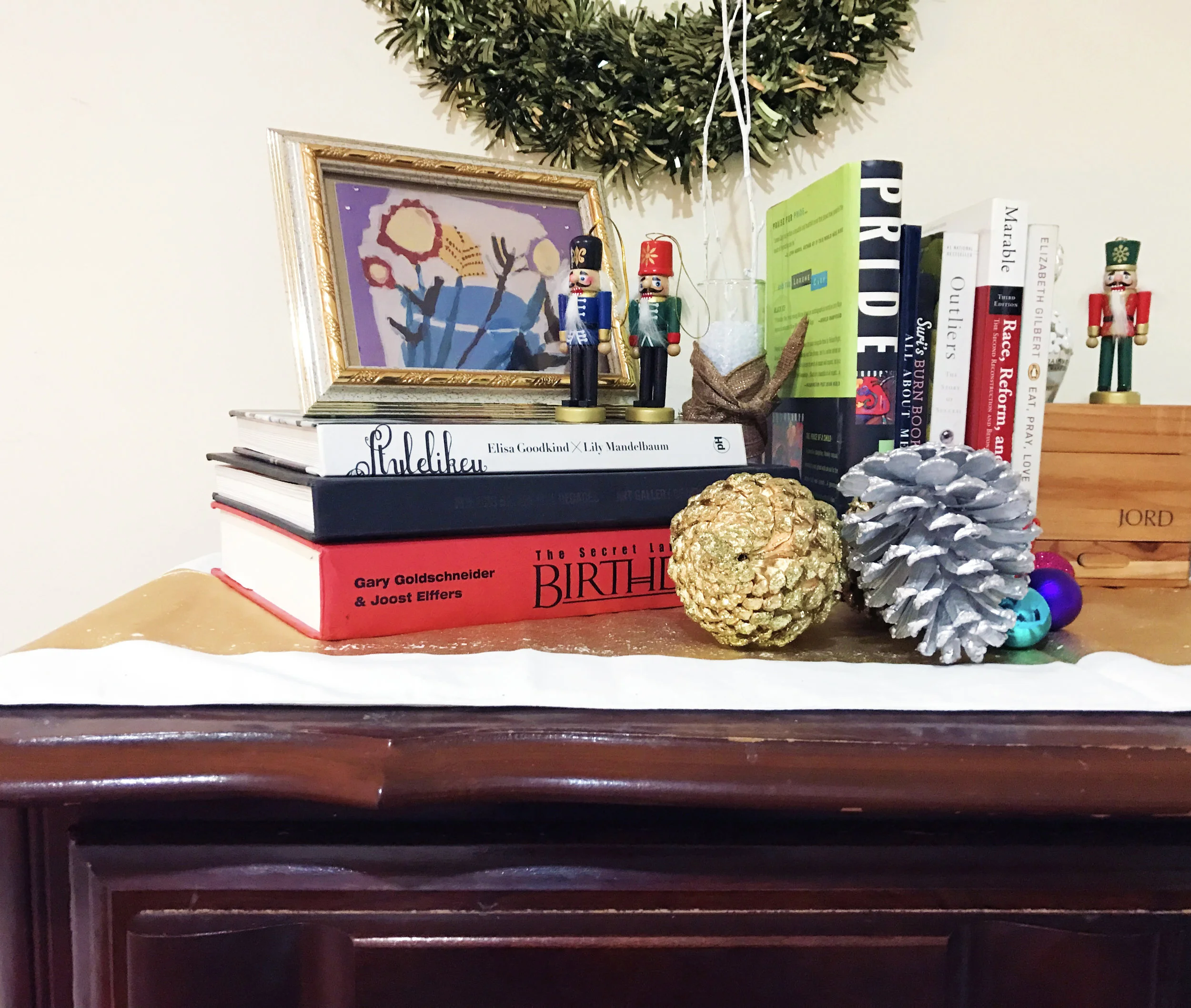 A mix of personal objects and Christmas decorations.