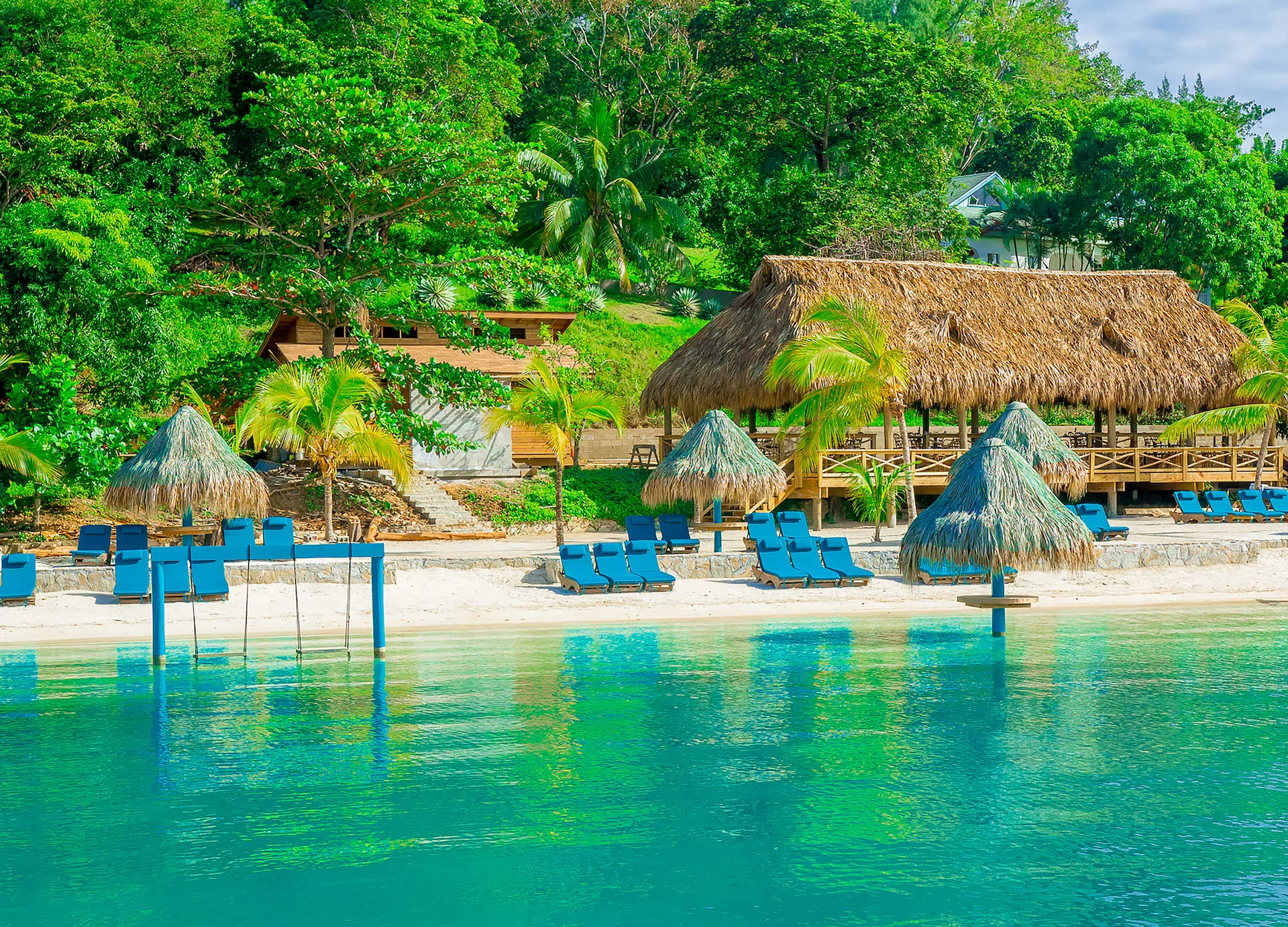 lounge-chairs-beach-tiki-turquoise-bay-roatan.jpg.webp