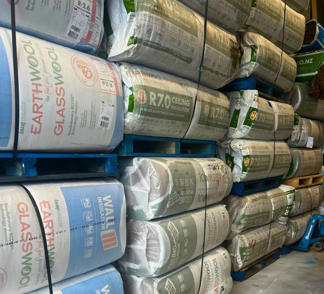 Pallets of packaged insulation in storage ready for installation in Bay of Plenty homes.