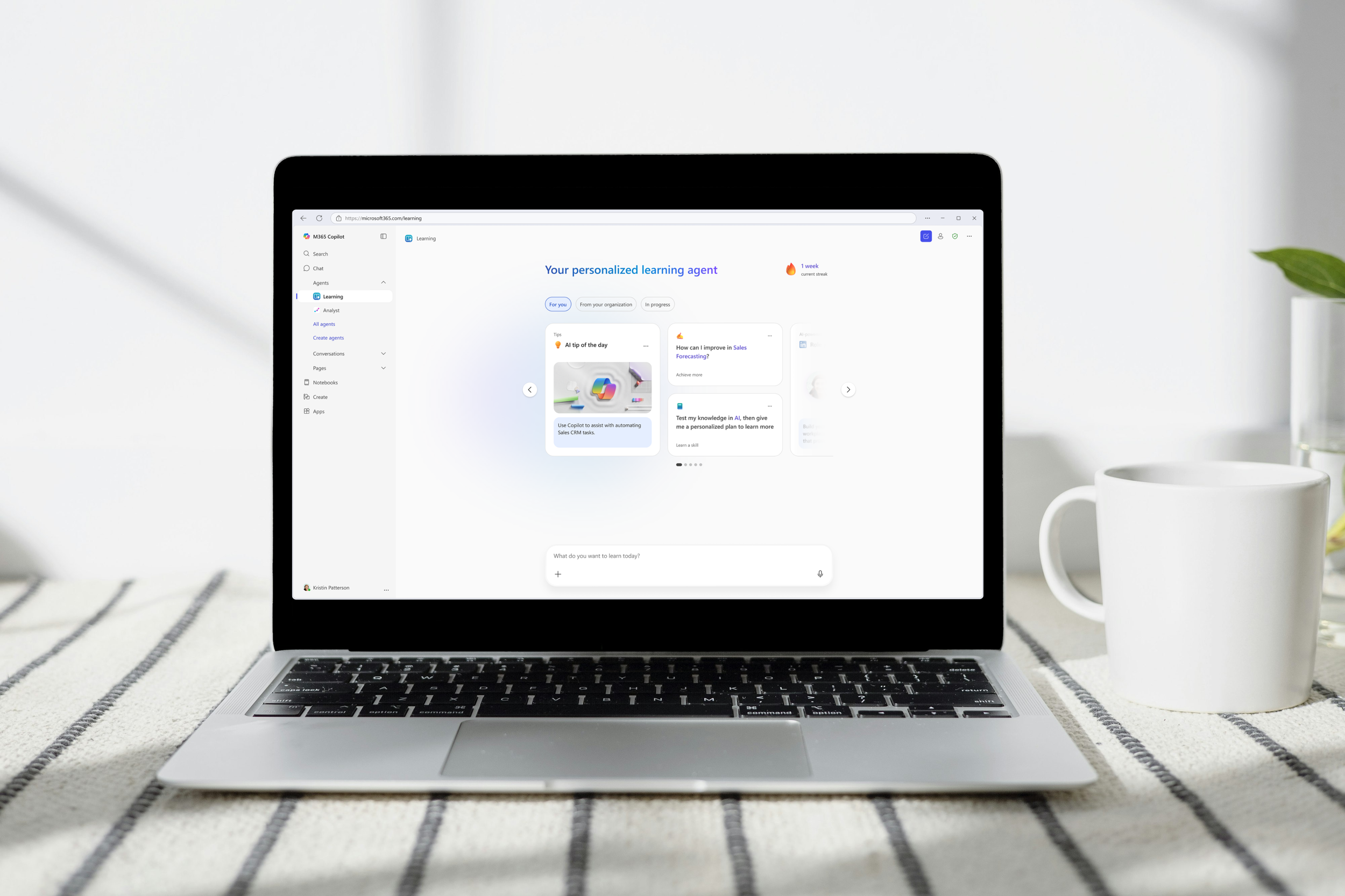 Image of Learning Agent landing page in a browser, set in a laptop