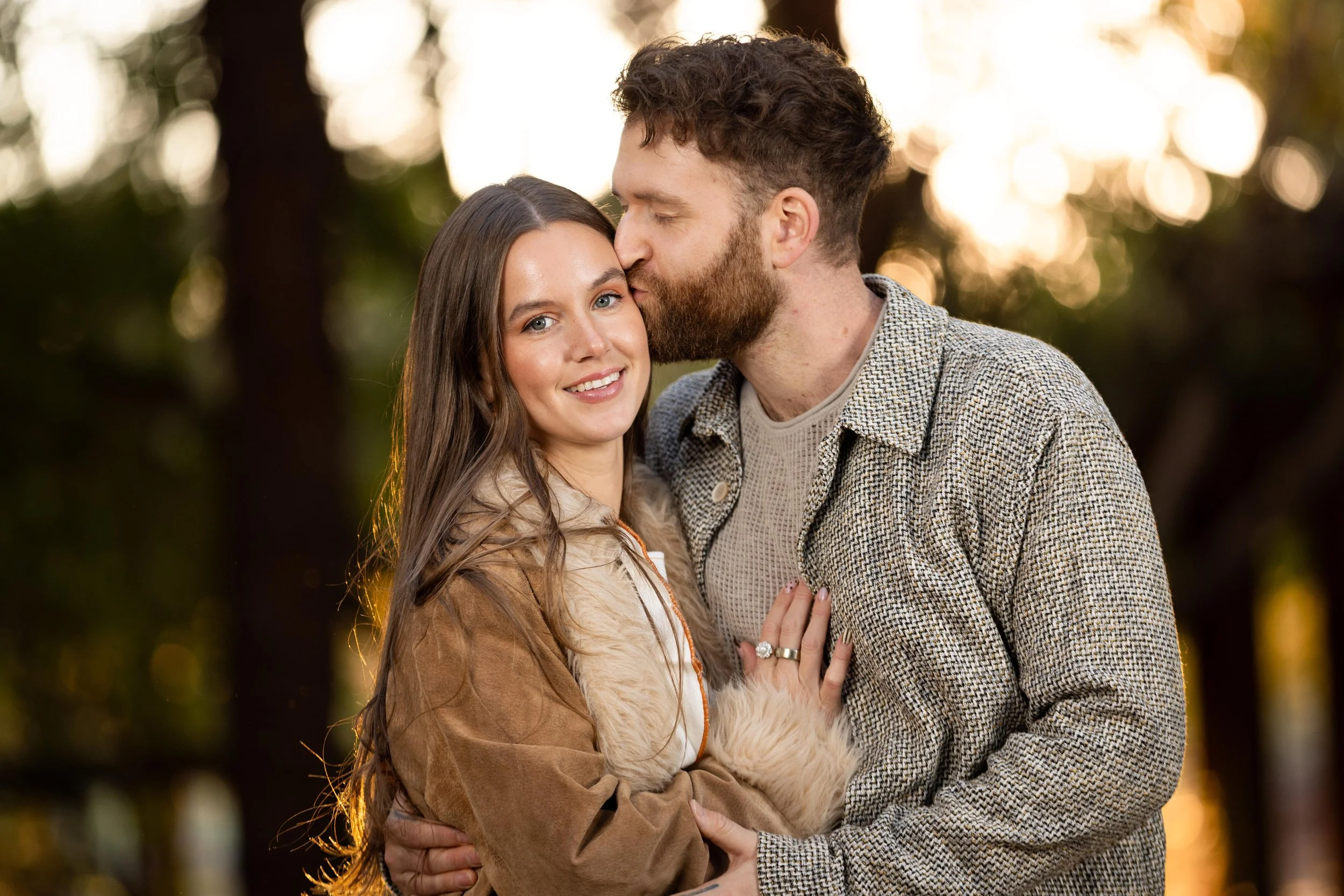 man kisses women during engagement session in southern Utah. Cinematic photographer.