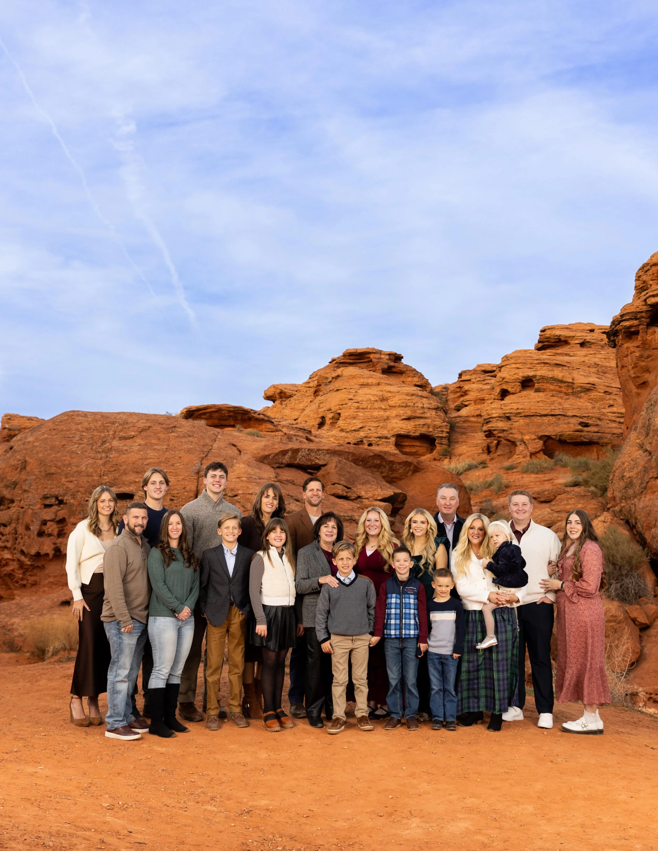 Cinematic extended family photos at the Pioneer Park red rocks in St. George Utah.