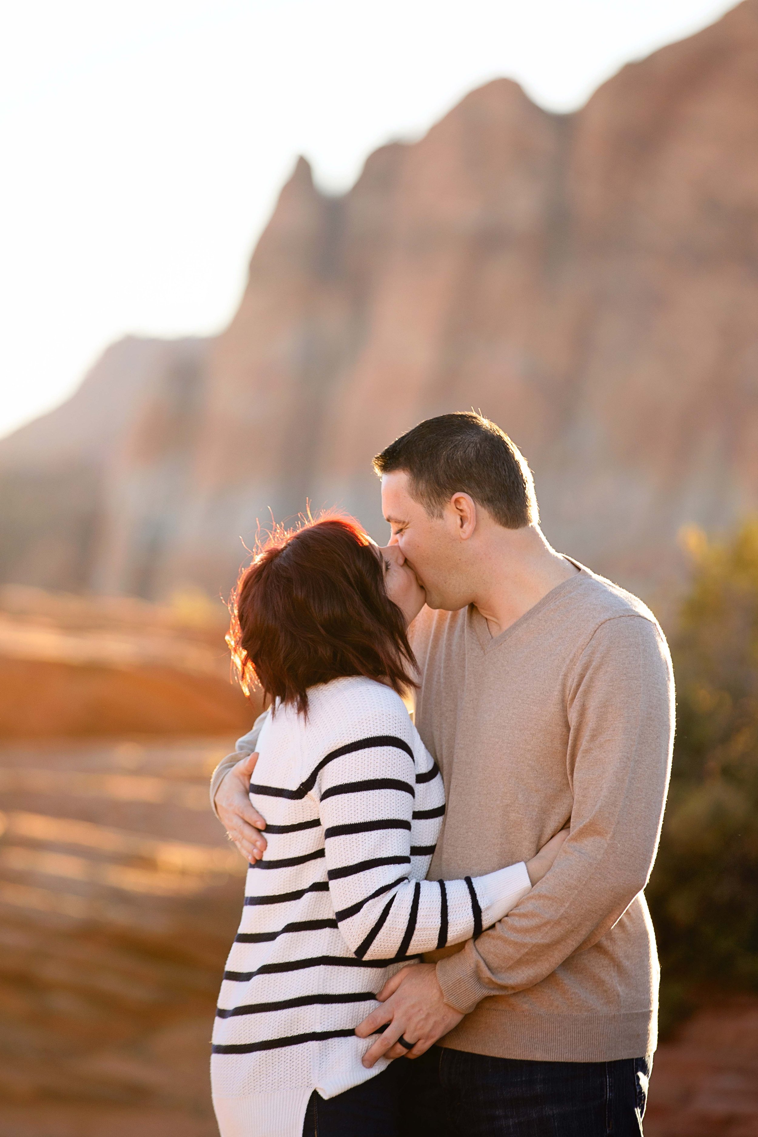 Parents-posing-together-in-the-red-rocks-of-Southern-Utah-family-session