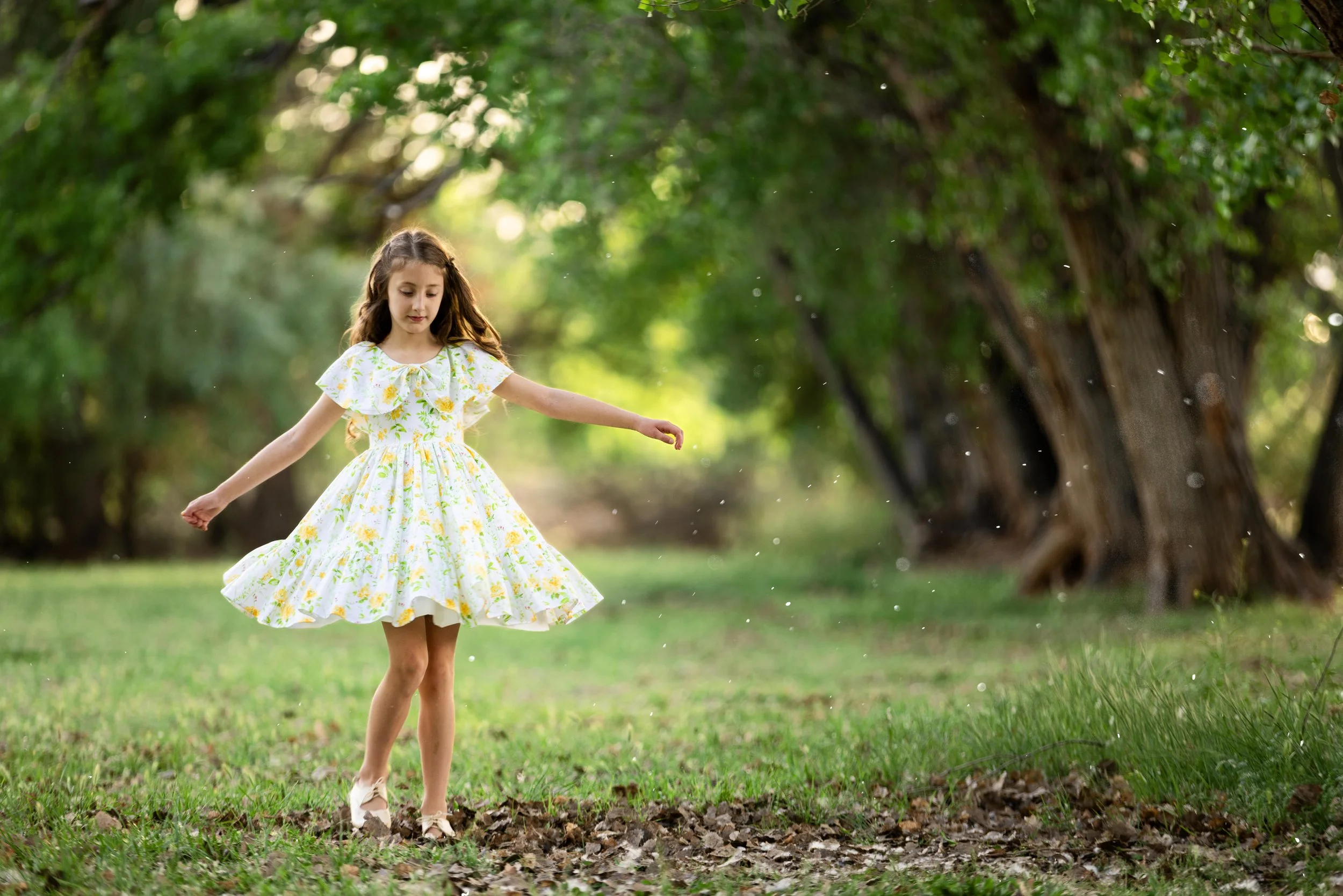 Girl twirling in the Kirkland Field in Washington Utah creating a magical storybook scene.