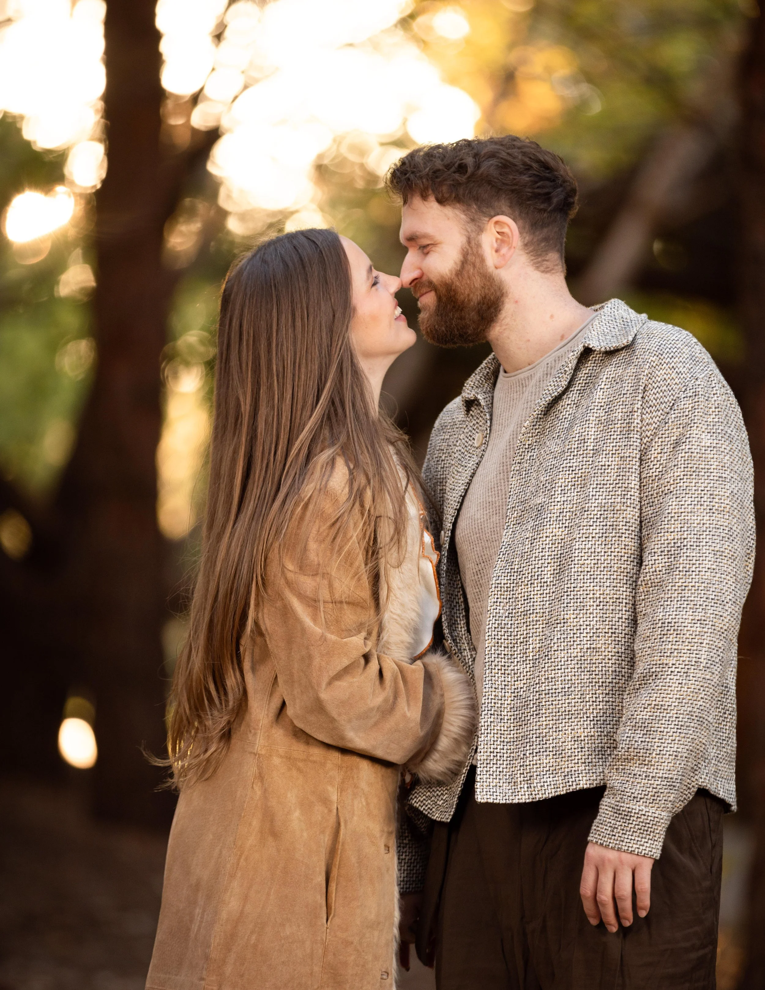 couple touching their noses together during cinematic engagement photo session in Southern Utah.
