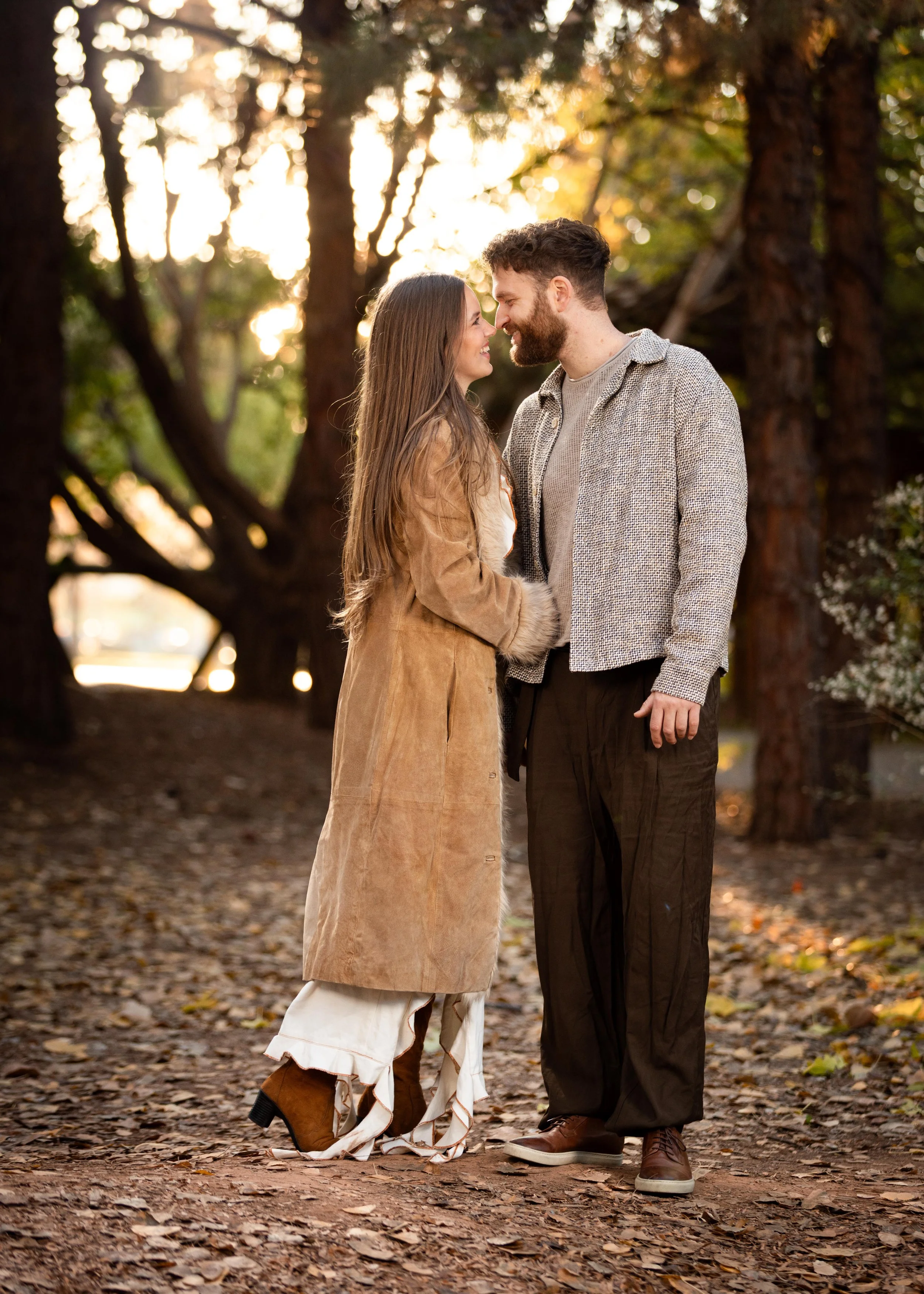 couple kissing during cinematic engagement session at the Tonaquint Nature center in Saint George Utah.