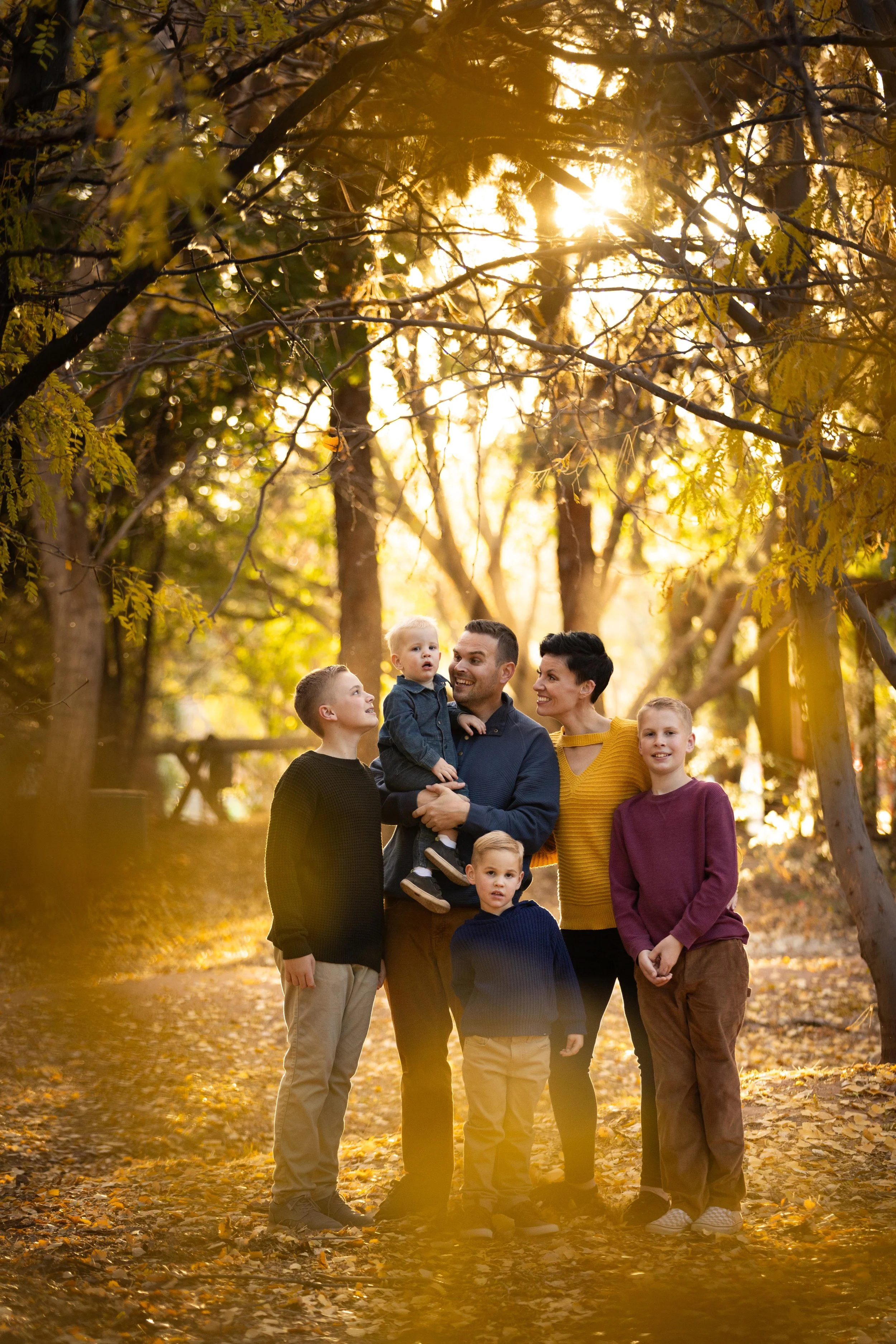 Deep and moody golden hour family photos at tonaquaint nature center in the fall