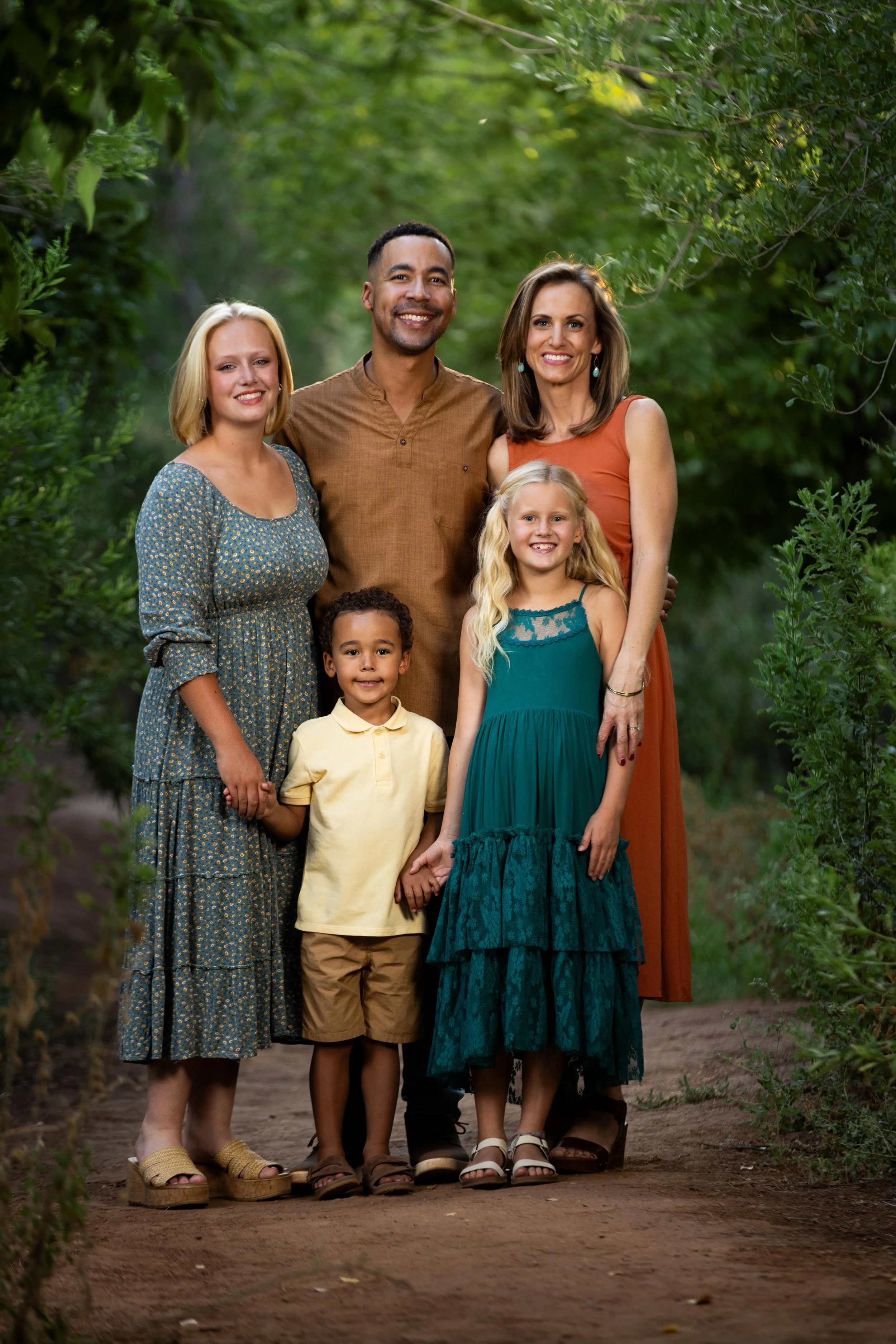 Family posing for Family pictures in Saint George Utah