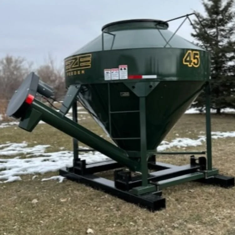 45-bushel-and-75-bushel-eze-feeder-lined-up-on-grass