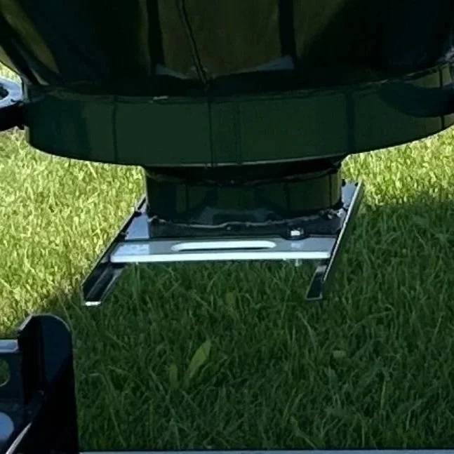 Close up shot of the bottom slide gate that opens and close to discharge feed, on  a green EZE Mini-Bin  