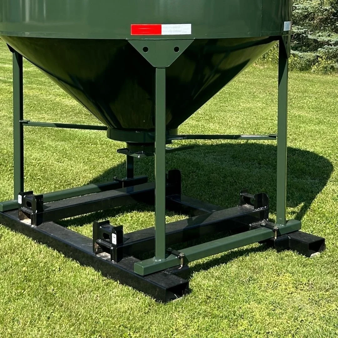 Bottom half view of an EZE Mini Bin sitting on green grass, showing the integrated fork pocket frame of the feed bin