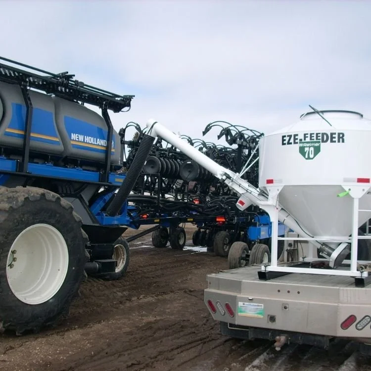 EZE-FEEDER 70 WITH 12' FOLDING AUGER & SPOUT EXTENSION WORKING WITH FLEXI-COIL-AIR SEEDER 
