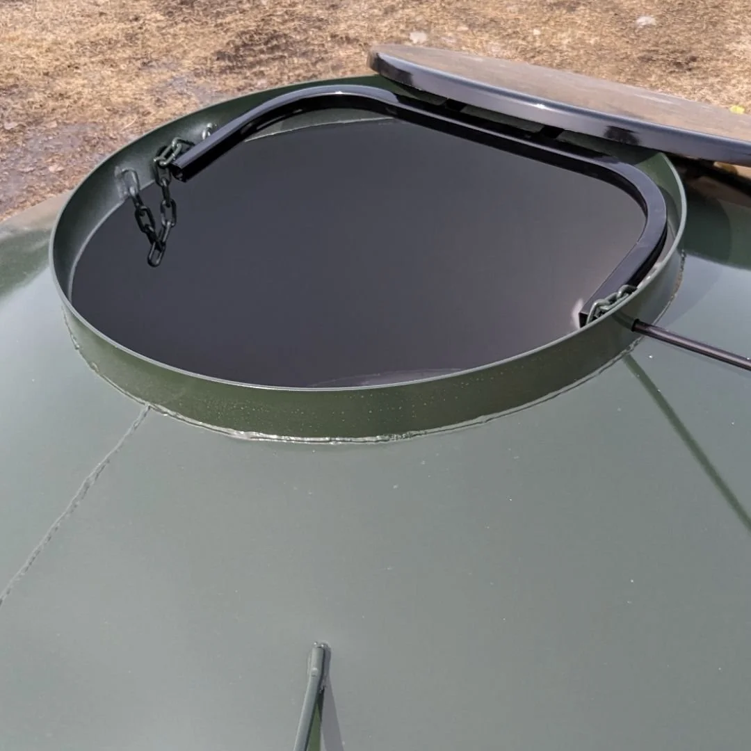 Top view of an empty green EZE Mini-Bin with the lid  open. 