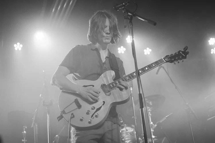 Tucker France plays guitar live in New Orleans.